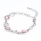 Conjunto de Liga de Ouro com Cristal Emporia® Branco e Cristal Emporia® Rosa ( Brincos+Pulseira )