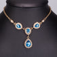 Conjunto de Liga de Ouro com Cristal Emporia® Azul e Cristal Emporia® Branco ( Colar+Brincos+Pulseira )