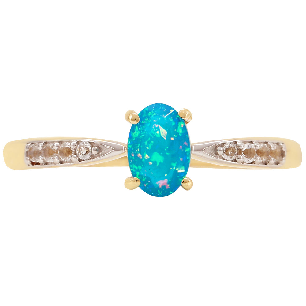 Anel de Ouro com Opala Azul Paraib da Etiópia e Topázio Branco  Contraste: Cruz missionária