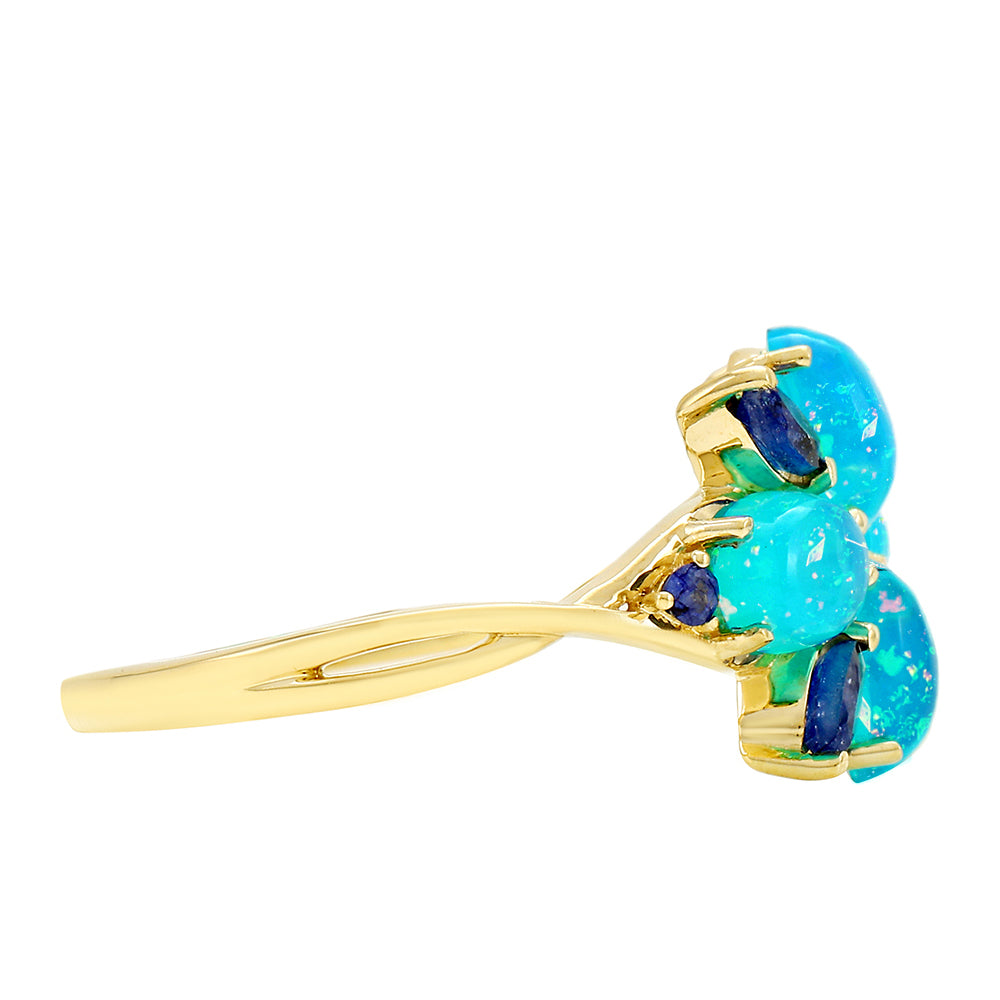 Anel de Ouro com Opala Azul Paraib da Etiópia e Safira Azul  Contraste: Cruz missionária