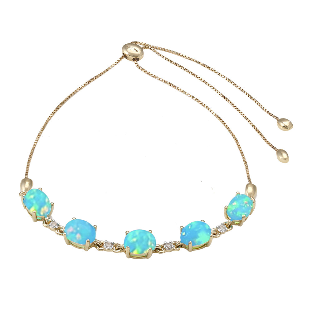 Pulseira de Ouro com Opala Azul Paraib da Etiópia e Topázio Branco  Contraste: Cruz missionária 1 