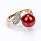 Anel de Prata com Banho de Ouro com Pérola Vermelha de Água Doce e Topázio Branco  Contraste: Cabeca de Veado (800)