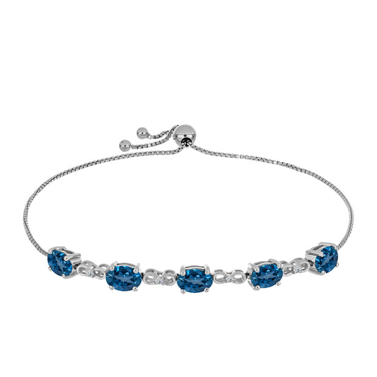 Pulseira de Prata com Topázio Azul de Londres e Topázio Branco  Contraste: Cabeca de Veado (800)