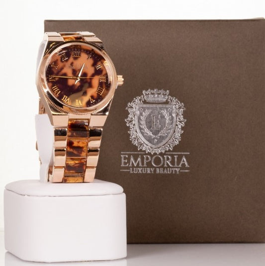 Relógio feminino Banhado a liga de Ouro Rosa com pulseira de listras de tigre e algarismos romanos na esfera.